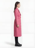 Side profile of Maverick Eira leather trench coat showing adjustable cuff straps and belted waist silhouette. Maverick Jacket.