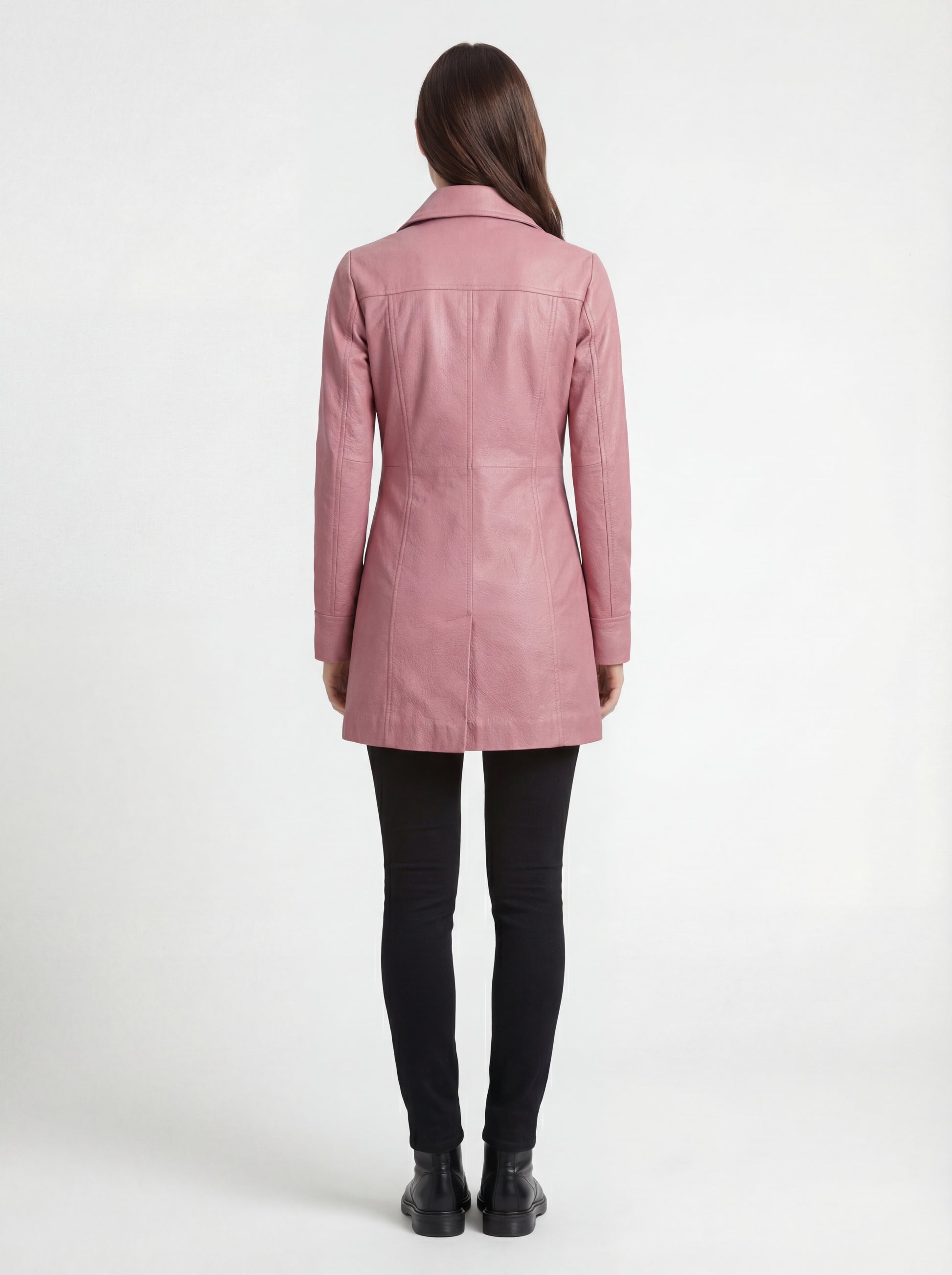 Rear view of female model wearing Maverick Camden leather walker coat showing fitted shoulders and vertical seam detailing. Maverick Camden.