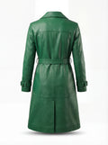Rear view of green leather trench coat showing structured yoke paneling and vented hem. The Aspen by Maverick Jacket.