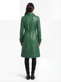 Rear view of female model wearing Maverick Aspen green leather trench coat showing structured shoulder fit and belted back styling. Maverick Jacket.