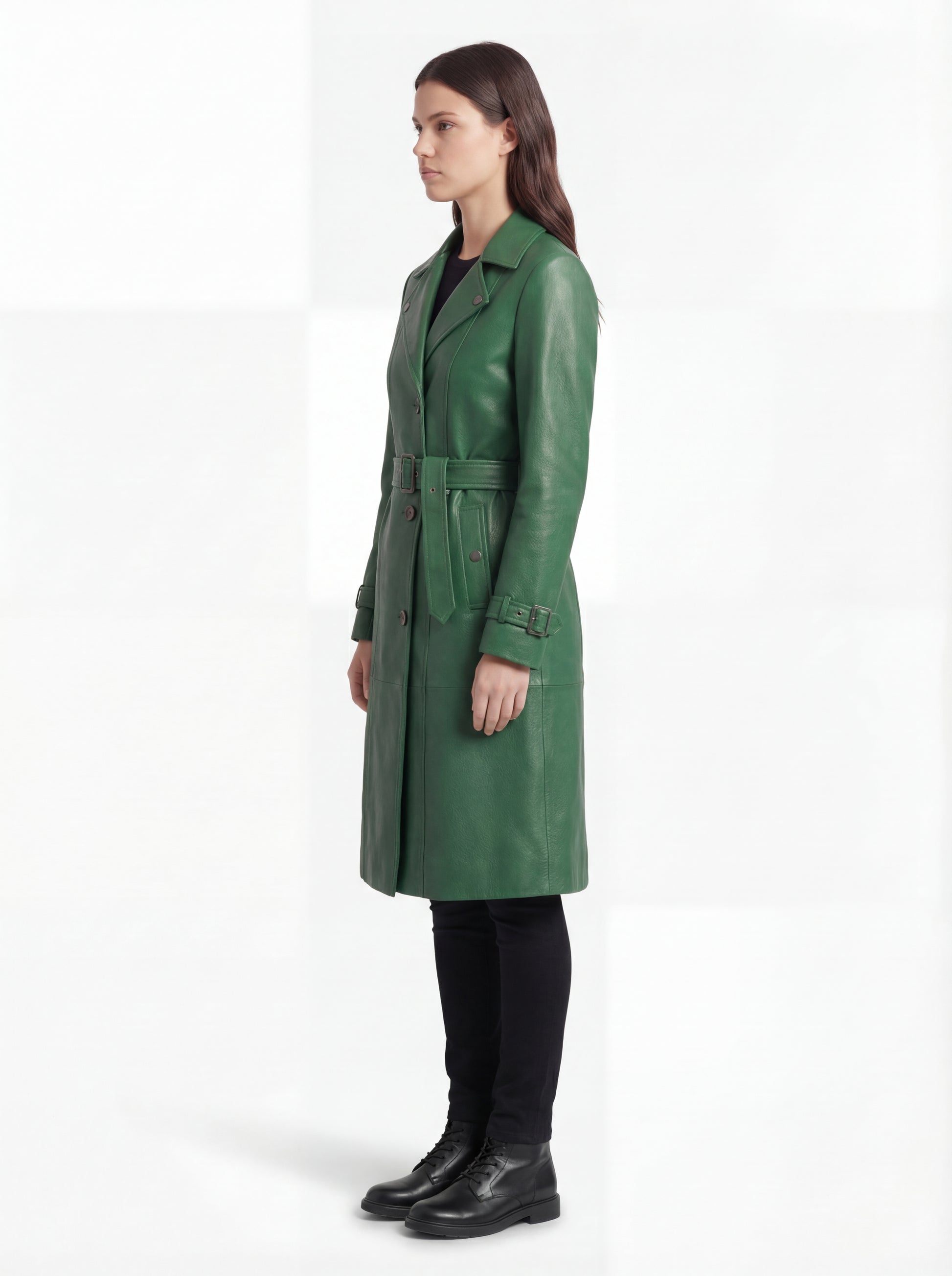 Side profile of Maverick Aspen leather trench coat showing long sleeve structure and belted silhouette. Maverick Jacket.