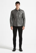 Male model wearing Maverick Grayson grey leather western shirt, regular fit, styled with black jeans. Maverick Jacket.