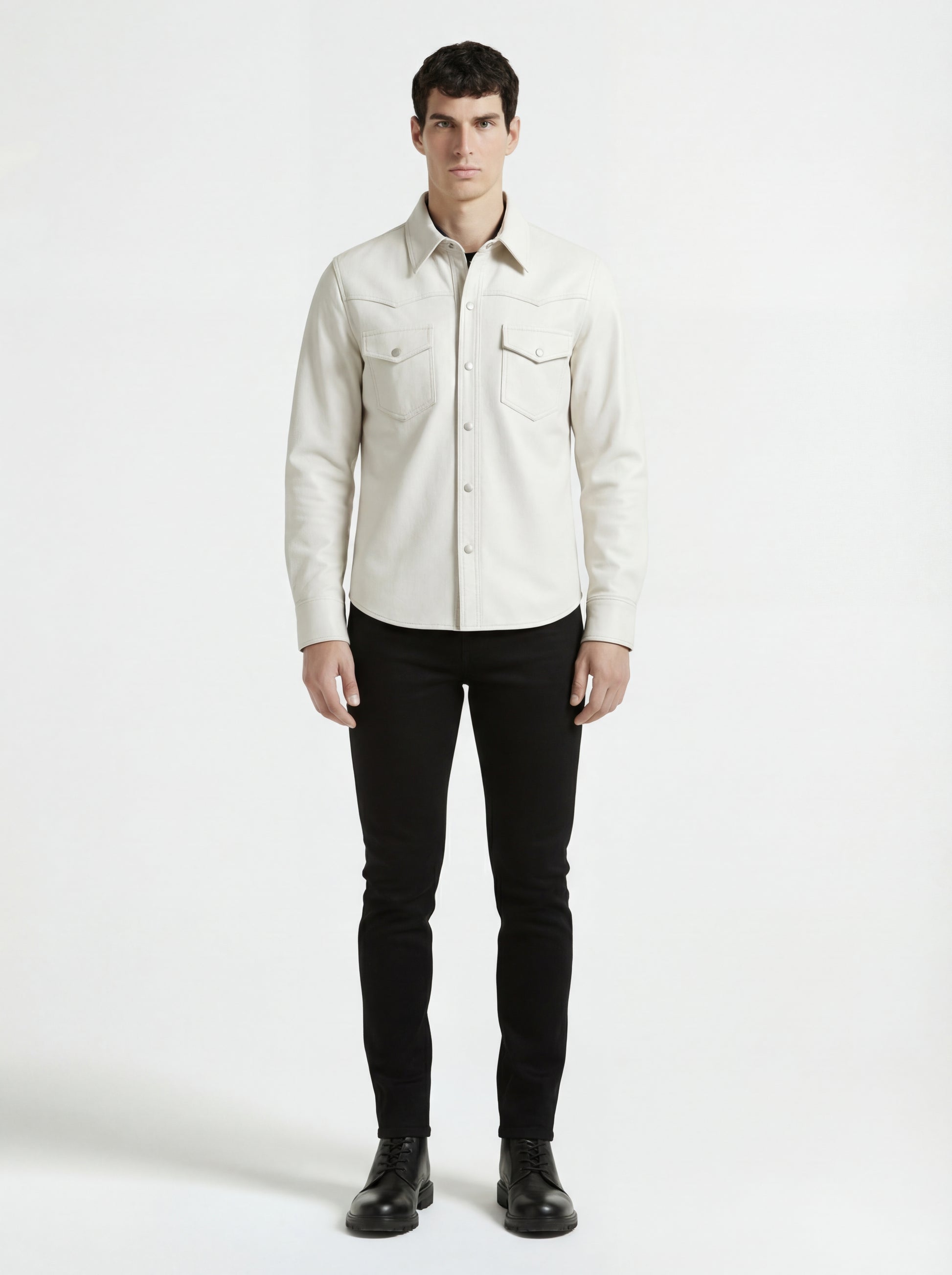 Male model wearing Maverick Tiernan off-white leather western shirt, regular fit, styled with black skinny jeans. Maverick Jacket.