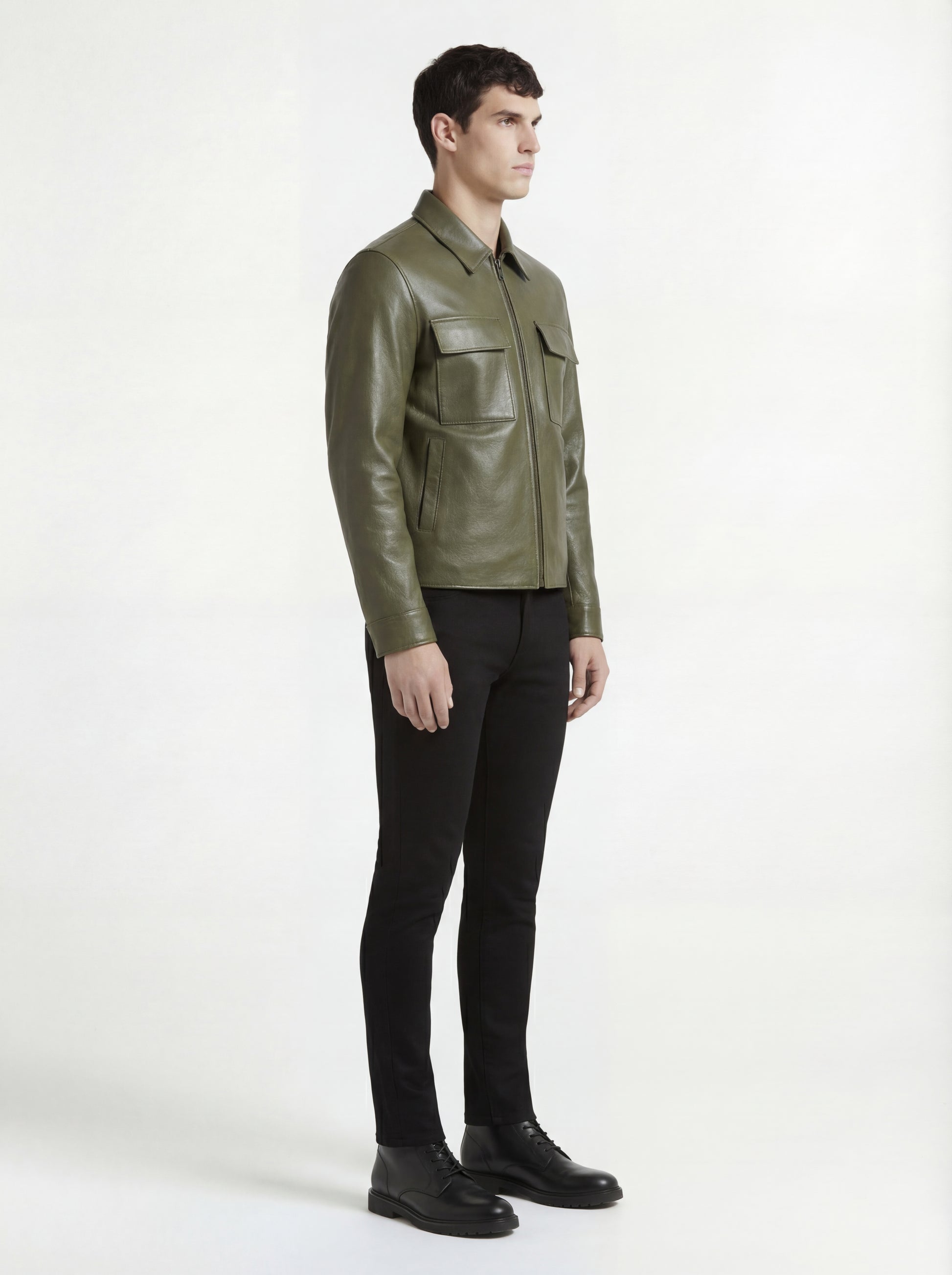 Side profile of Maverick Killian leather zip shirt showing full sleeve structure and clean torso silhouette. Maverick Jacket.