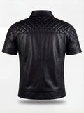 Rear view of black leather short-sleeve shirt showing diamond quilted yoke and vertical back seams. The Mason by Maverick Jacket.