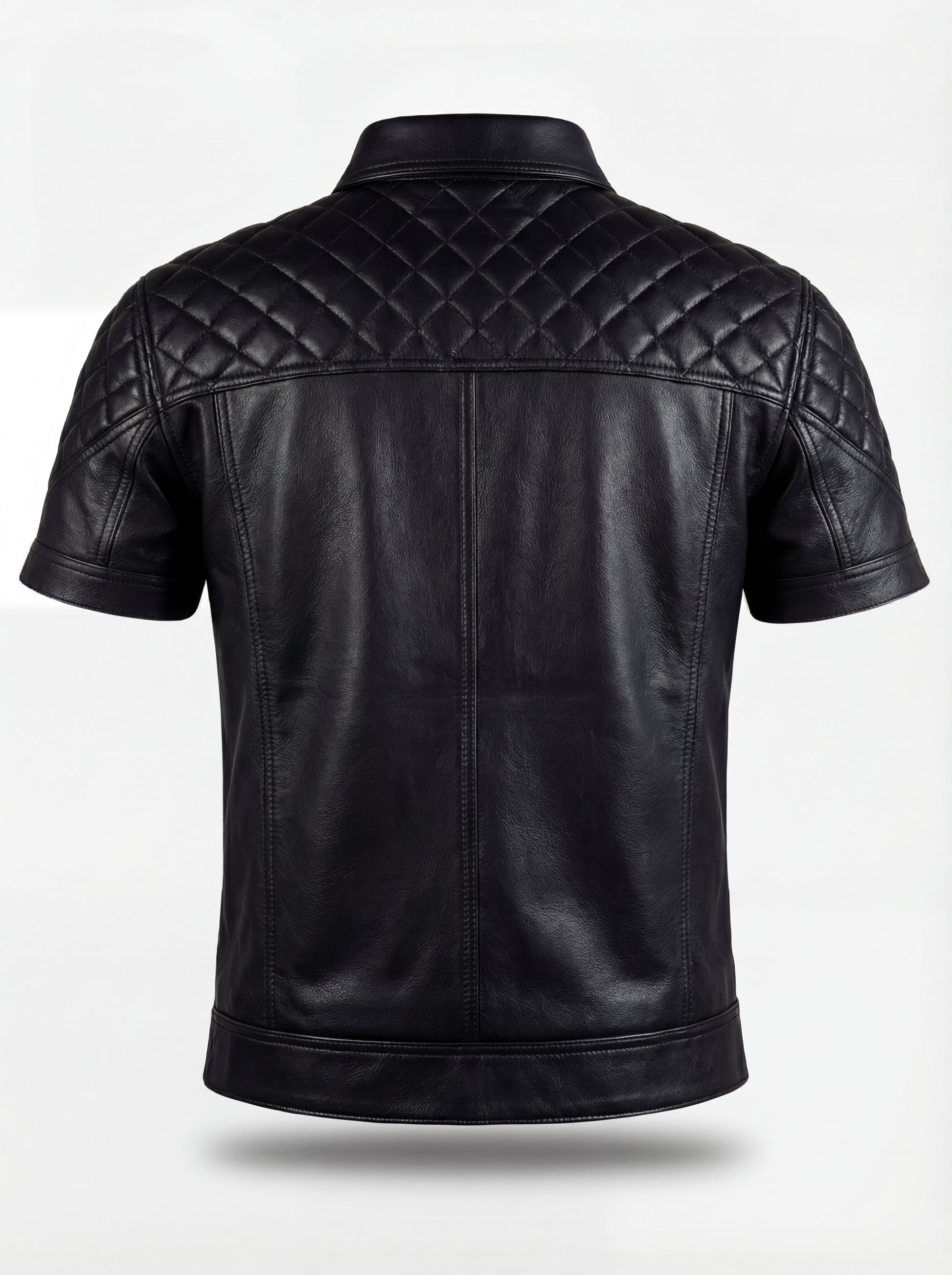 Rear view of black leather short-sleeve shirt showing diamond quilted yoke and vertical back seams. The Mason by Maverick Jacket.