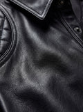 Macro shot of grained black leather texture and diamond quilted stitching on shirt shoulder. The Mason by Maverick Jacket.