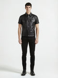 Male model wearing Maverick Mason short-sleeve leather shirt, slim fit, styled with black skinny jeans. Maverick Jacket.