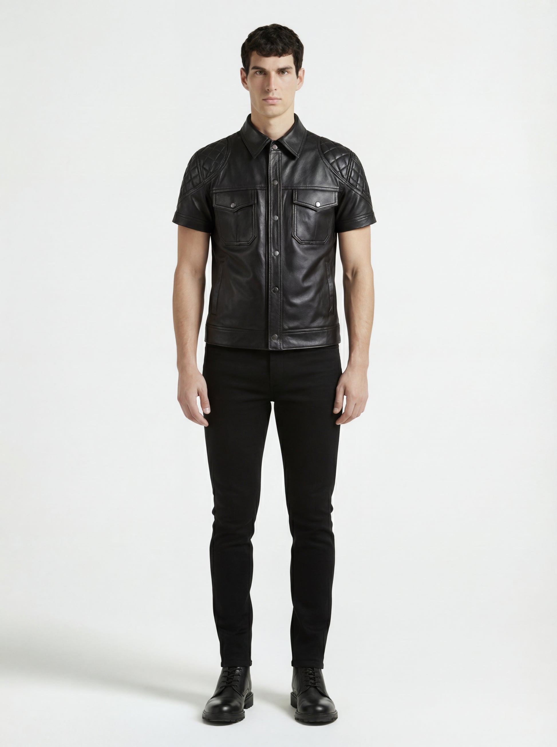 Male model wearing Maverick Mason short-sleeve leather shirt, slim fit, styled with black skinny jeans. Maverick Jacket.