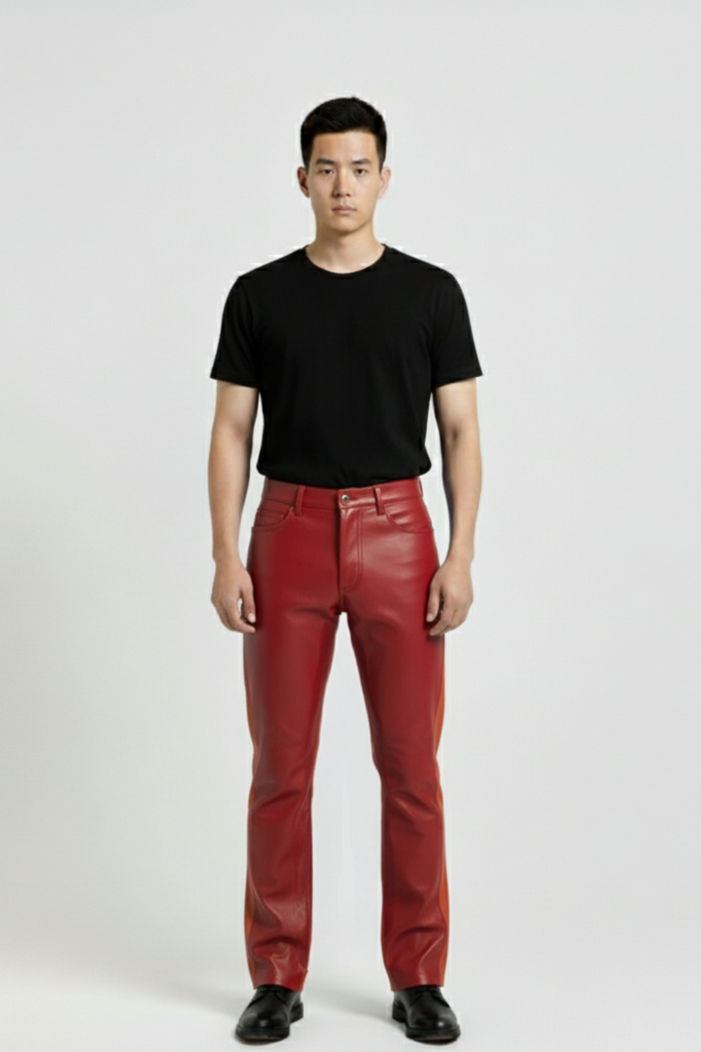 Male model wearing Maverick Jagger two-tone leather racing pants, slim fit, styled with black crewneck t-shirt. Maverick Jacket.