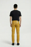 Rear view of male model wearing Maverick Huxley leather trousers showing tailored seat fit and straight leg structure. Maverick Jacket.