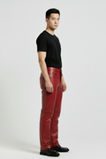 Side profile of Maverick Knox red leather pants showing knee seam detail and straight leg silhouette. Maverick Jacket.