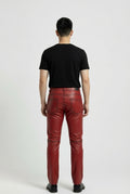 Rear view of male model wearing Maverick Knox red leather pants showing fitted seat silhouette and rear pocket styling. Maverick Jacket.