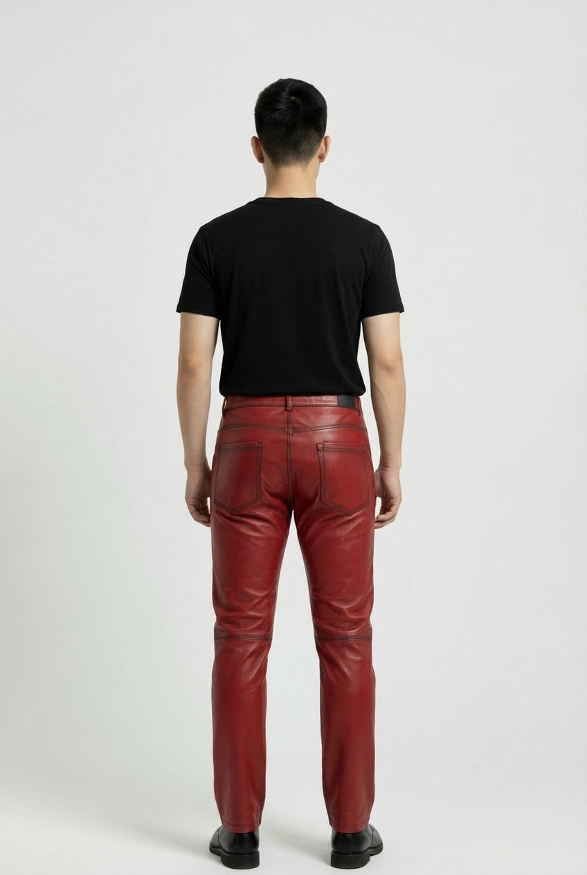 Rear view of male model wearing Maverick Knox red leather pants showing fitted seat silhouette and rear pocket styling. Maverick Jacket.
