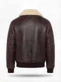 Rear view of dark brown leather aviator jacket showing clean back panel design and ribbed knit waistband. The Nomad by Maverick Jacket.