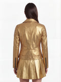 Rear view of female model wearing Maverick Aurora leather biker jacket showing structured shoulder fit and quilted panel construction. Maverick Jacket.
