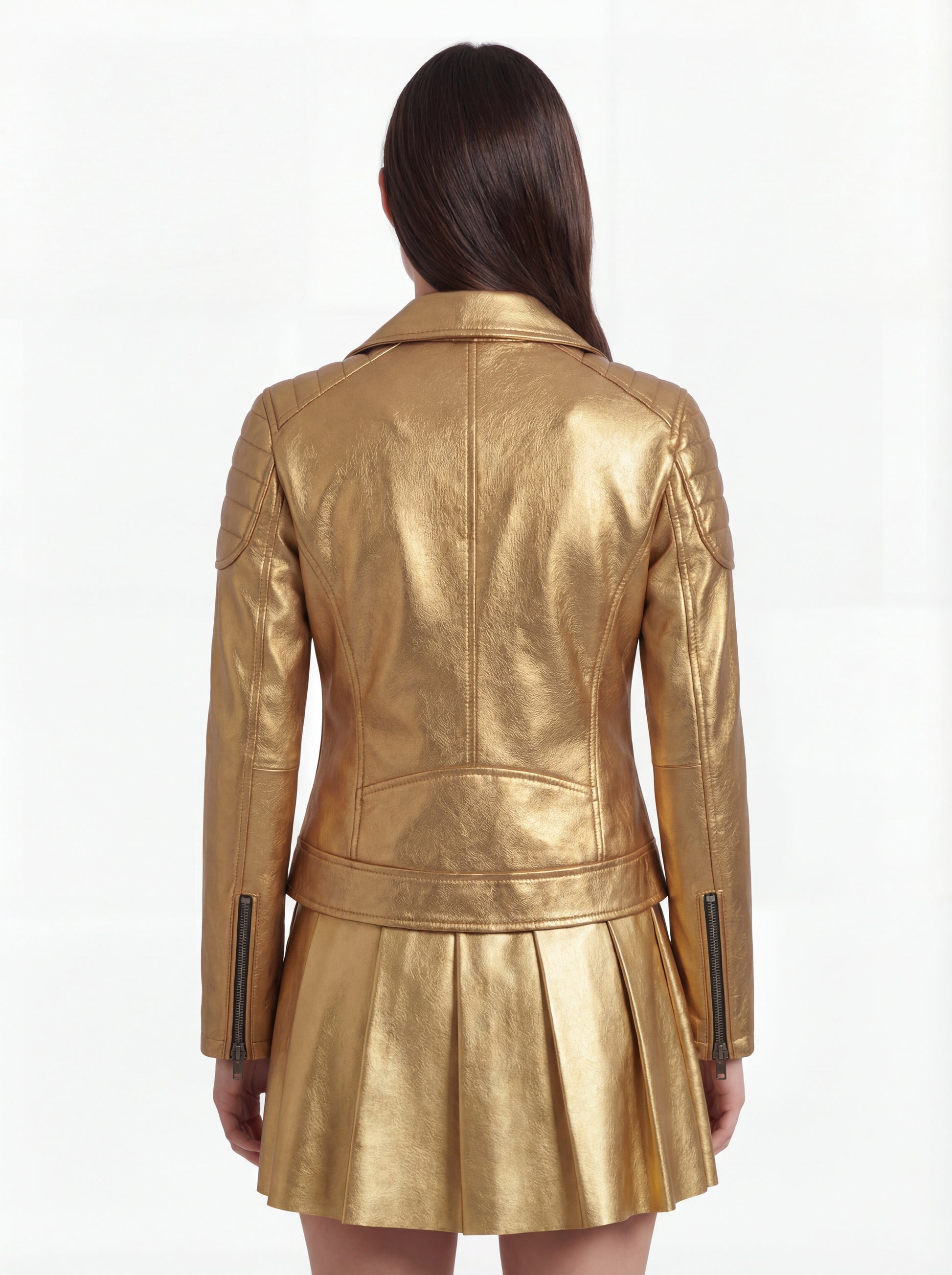 Rear view of female model wearing Maverick Aurora leather biker jacket showing structured shoulder fit and quilted panel construction. Maverick Jacket.