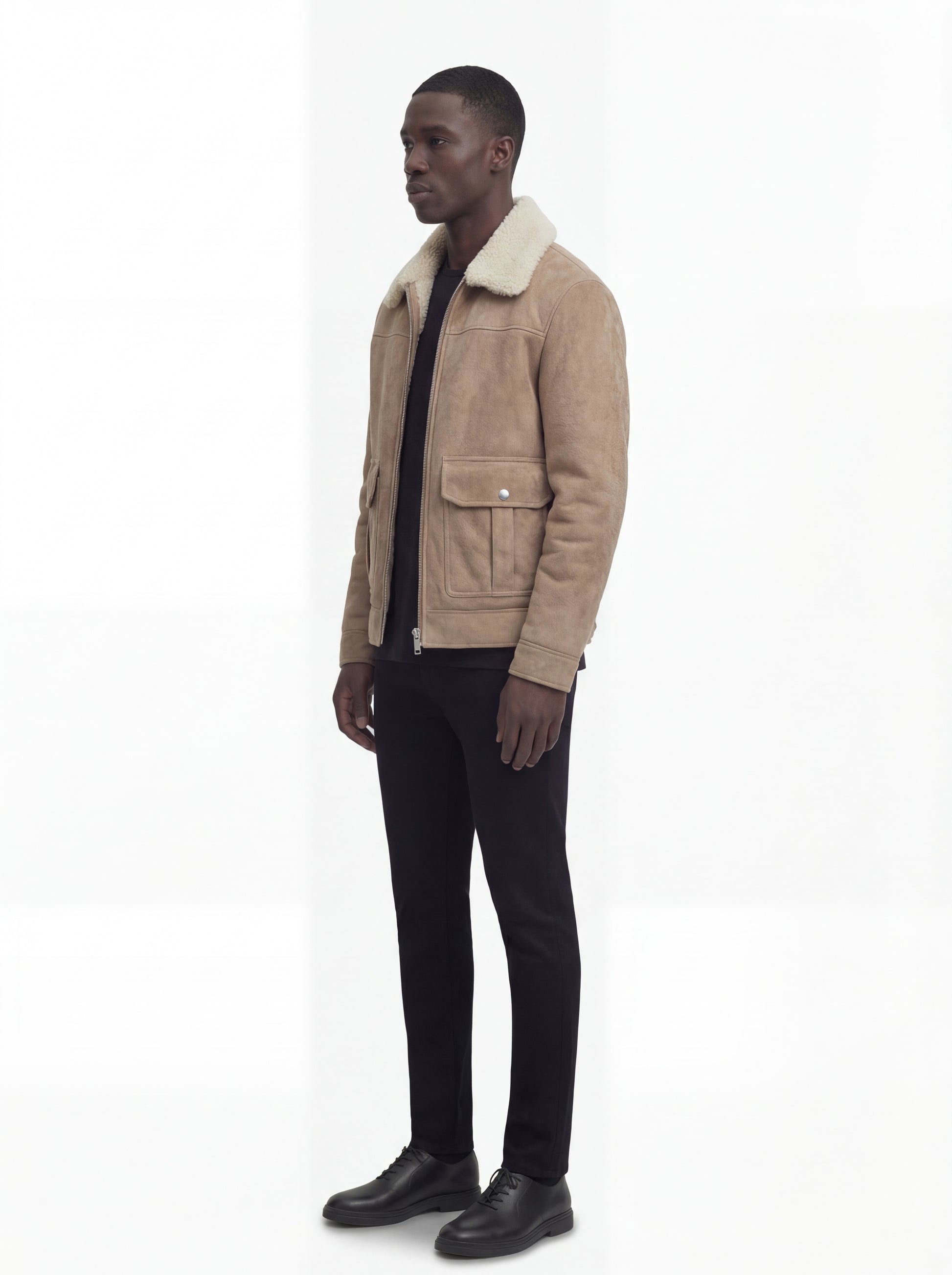 Side profile of Maverick Dune shearling jacket showing set-in sleeve structure and relaxed silhouette. Maverick Jacket.