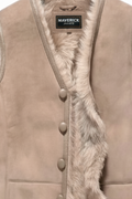 Macro shot of soft tan leather texture and thick shearling wool lining on vest. The Owen by Maverick Jacket.