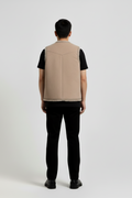Rear view of male model wearing Maverick Owen shearling vest showing structured shoulder fit and clean back styling. Maverick Jacket.