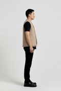 Side profile of Maverick Owen shearling vest showing deep armhole cut and straight torso silhouette. Maverick Jacket.