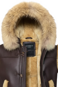 Macro shot of thick shearling fur texture and metal zipper hardware on vest. The Magnus by Maverick Jacket.