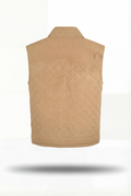 Rear view of tan suede quilted vest showing horizontal quilt stitching and ribbed hem. The Leo Maverick Jacket.