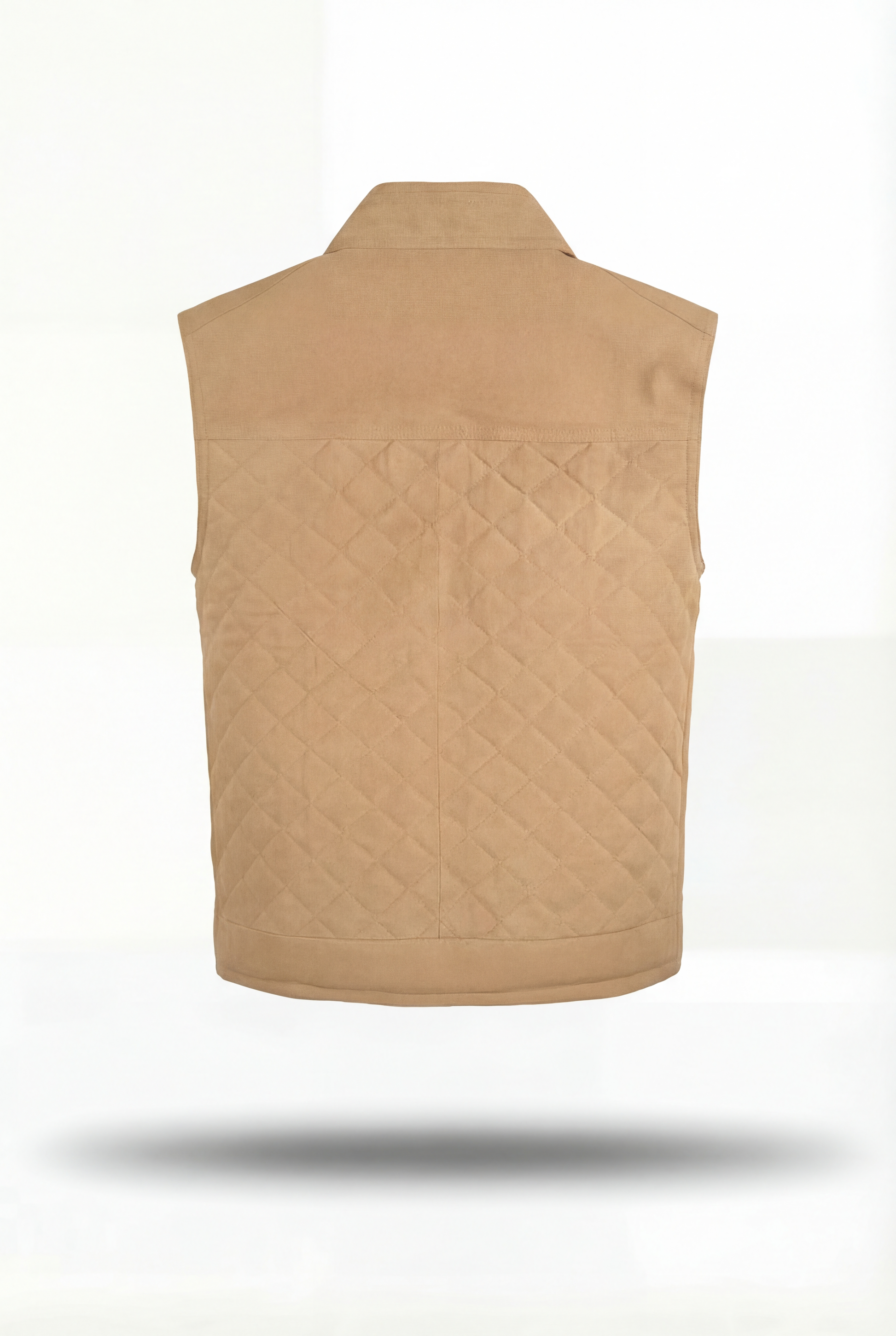 Rear view of tan suede quilted vest showing horizontal quilt stitching and ribbed hem. The Leo Maverick Jacket.