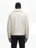 Rear view of male model wearing Maverick Summit shearling jacket showing structured shoulder fit and buckle-tab hem styling. Maverick Jacket.