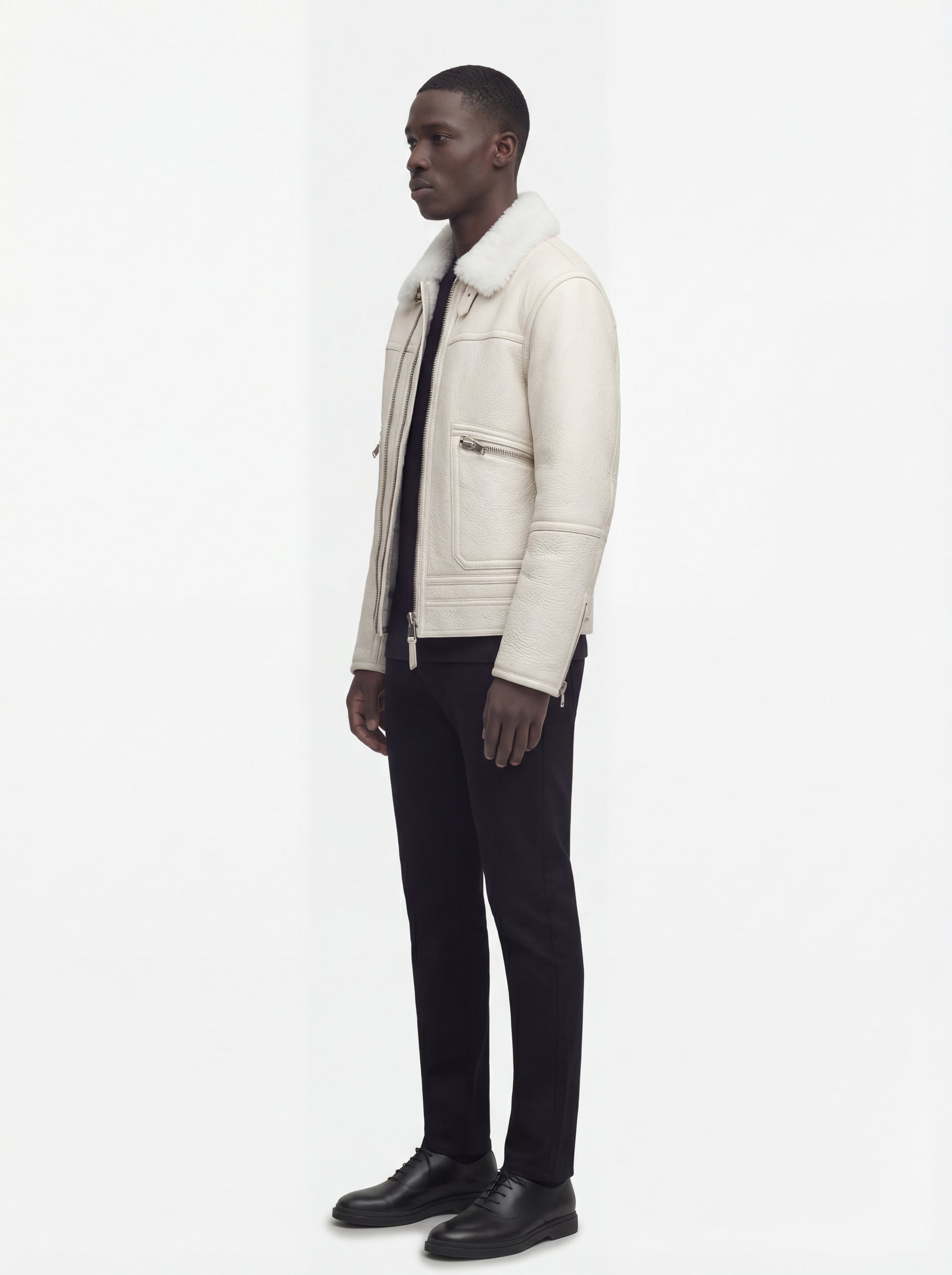 Side profile of Maverick Summit shearling jacket showing zippered sleeve cuffs and relaxed torso silhouette. Maverick Jacket.