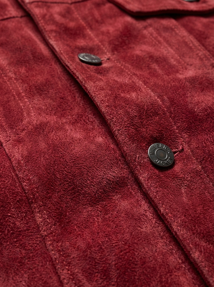 Macro shot of soft red suede texture and silver hardware detail on trucker jacket. The Strider by Maverick Jacket.