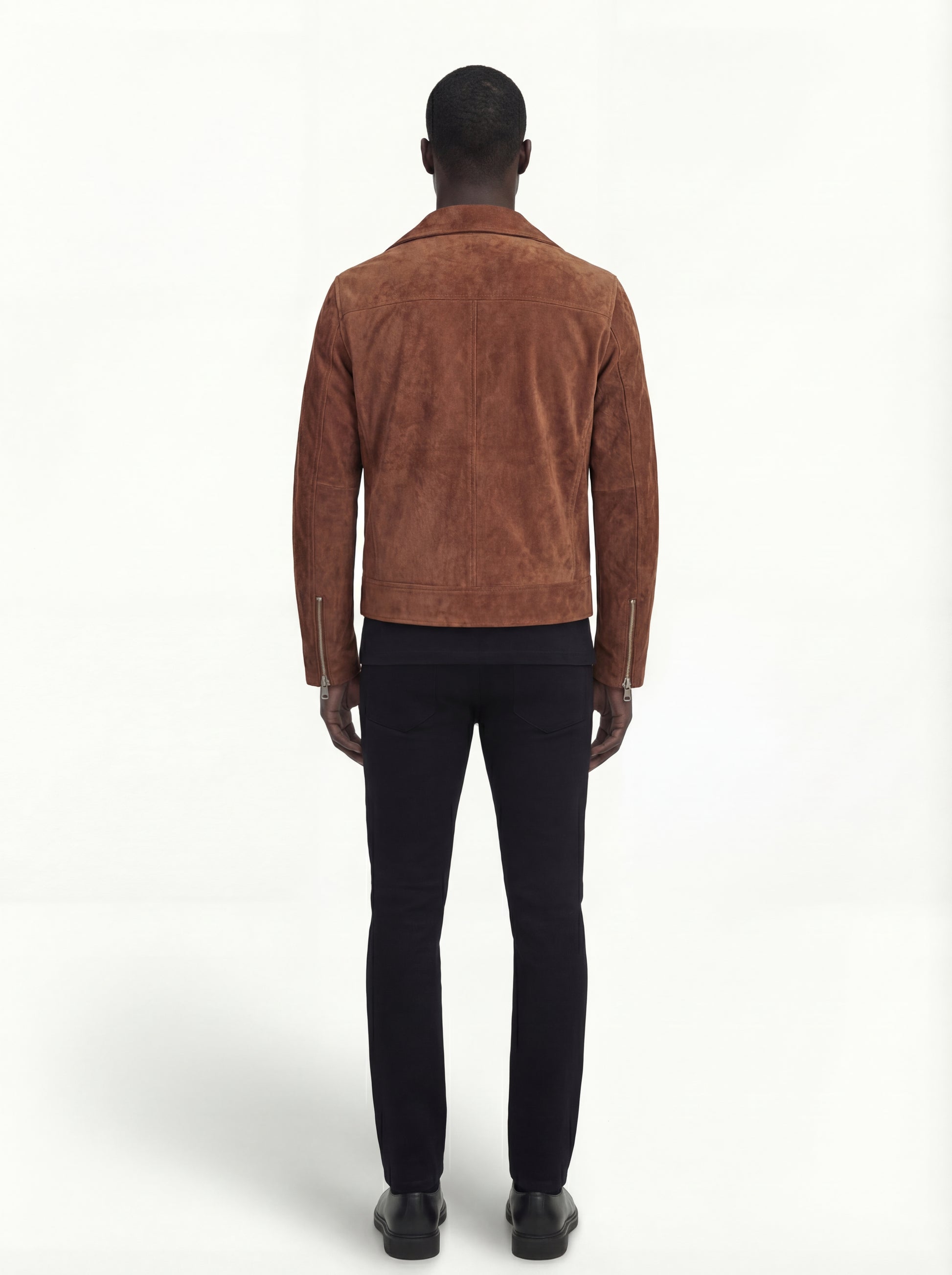 Rear view of male model wearing Maverick Canyon suede biker jacket showing tailored shoulder fit and clean back styling. Maverick Jacket.