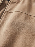 Macro shot of soft tan suede texture and metal zipper hardware on bomber jacket. The Cian by Maverick Jacket.