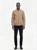 Male model wearing Maverick Cian suede bomber jacket, regular fit, styled with black jeans. Maverick Jacket.