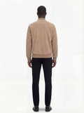 Rear view of male model wearing Maverick Cian suede bomber jacket showing broad shoulder fit and ribbed waist styling. Maverick Jacket.