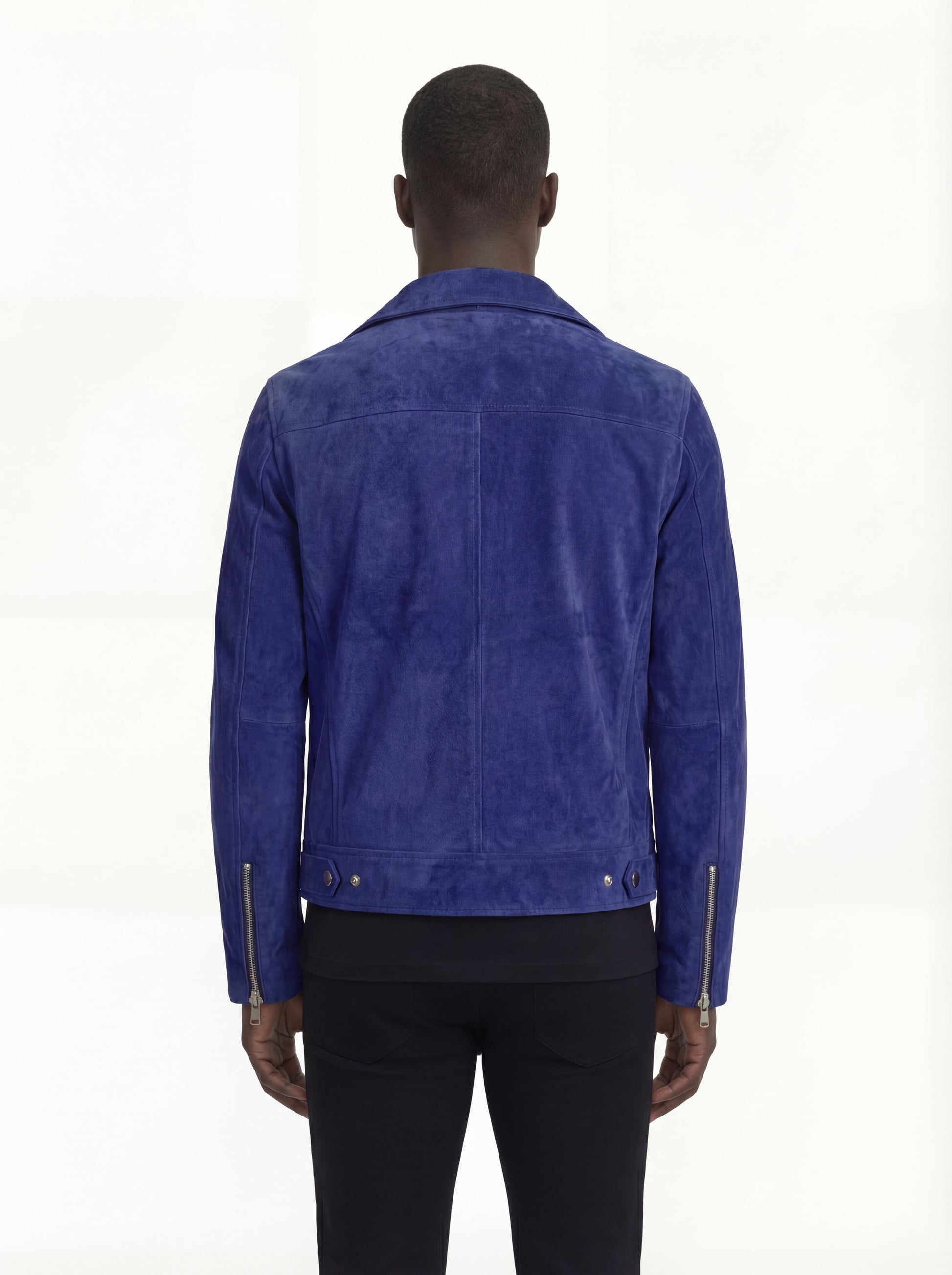 Rear view of male model wearing Maverick Aether suede biker jacket showing tailored shoulder fit and clean back styling. Maverick Jacket.