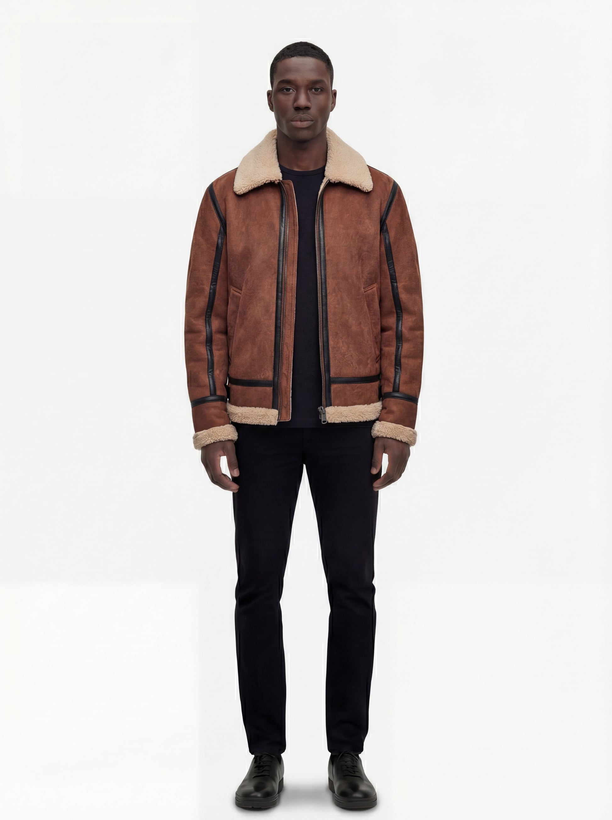 Male model wearing Maverick Altitude shearling B3 jacket, regular fit, styled with black crewneck top and black slim trousers. Maverick Jacket.
