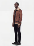 Side profile of Maverick Altitude shearling B3 jacket showing contrast sleeve taping and straight torso silhouette. Maverick Jacket.