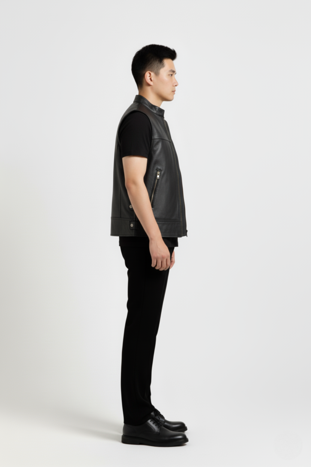 Side profile of Maverick Jaxon leather vest showing sleeveless armhole cut and boxy silhouette. Maverick Jacket.