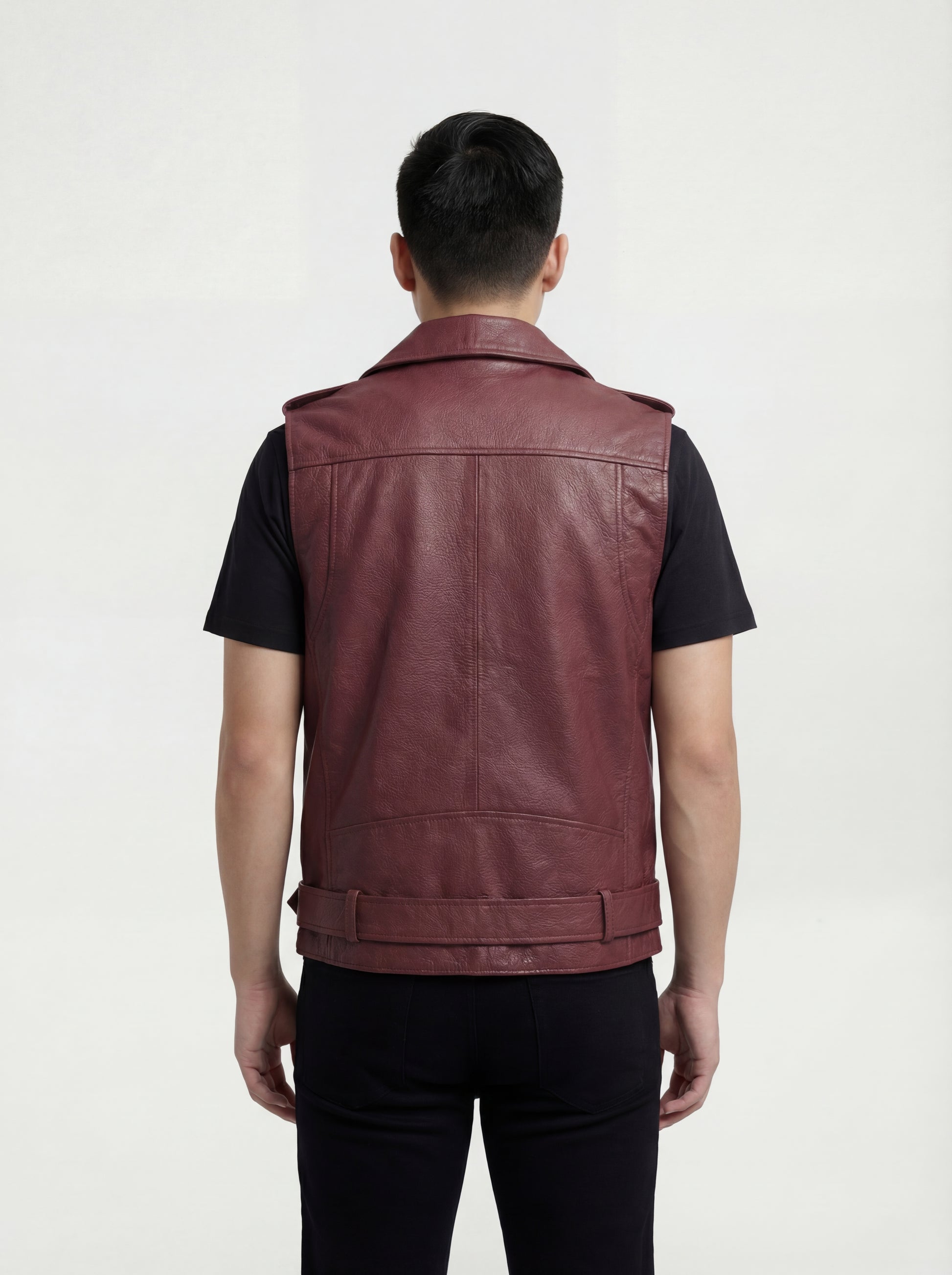 Rear view of male model wearing Maverick Valor leather biker vest showing broad shoulder fit and clean back styling. Maverick Jacket.