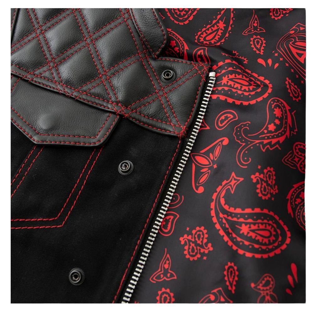 Macro shot of textile fabric contrasting with leather trim and silver zipper hardware on vest. The Ryker by Maverick Jacket.