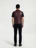 Rear view of male model wearing Maverick Rook leather button vest showing broad shoulder fit and clean back styling. Maverick Jacket.