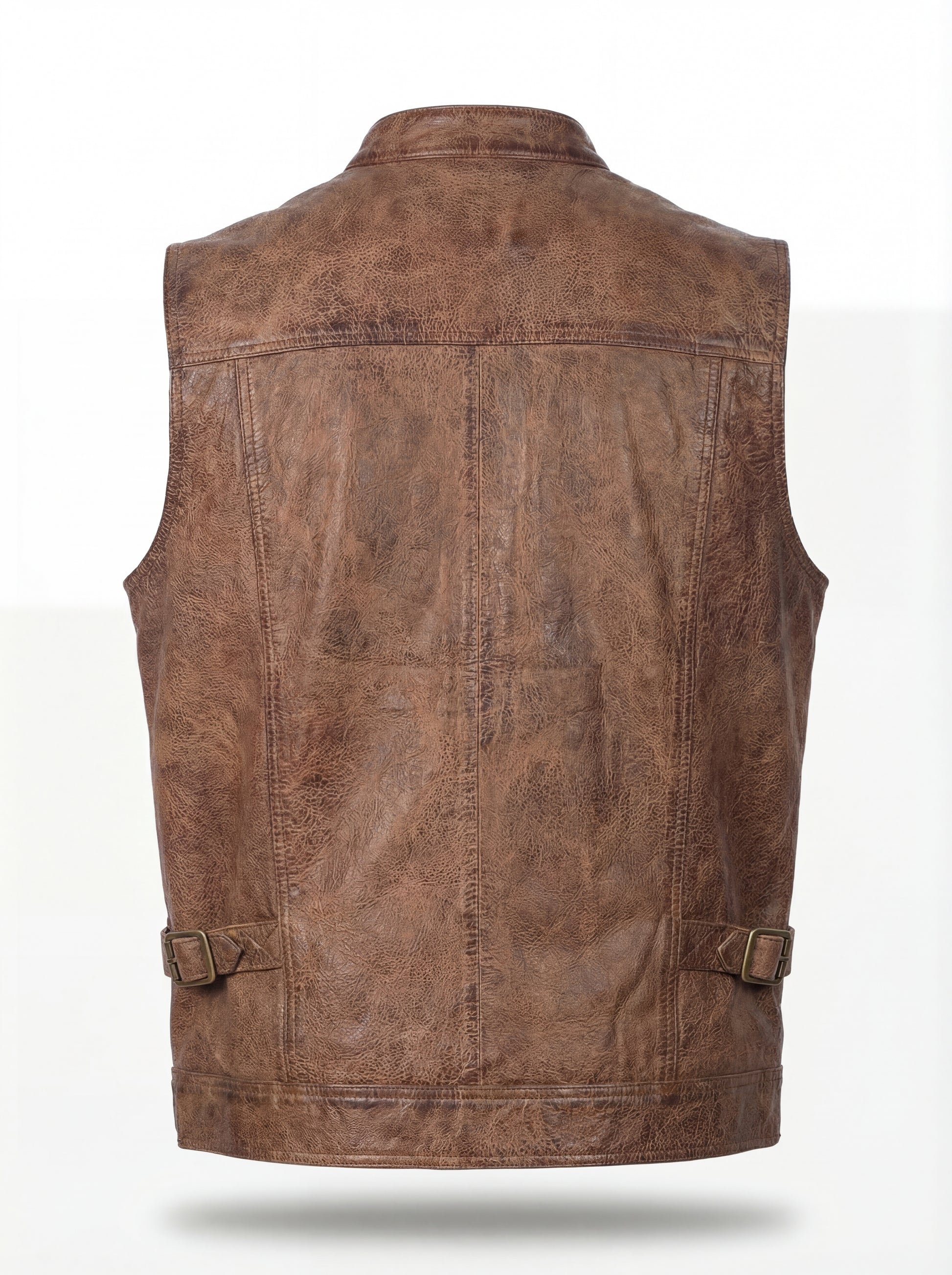 Rear view of distressed brown leather vest showing rugged back paneling and adjustable side waist tabs. The Drifter by Maverick Jacket.
