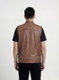 Rear view of male model wearing Maverick Drifter leather vest showing broad shoulder fit and clean back styling. Maverick Jacket.