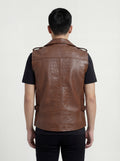 Rear view of male model wearing Maverick Drake croc-embossed leather biker vest showing broad shoulder fit and textured back styling. Maverick Jacket.