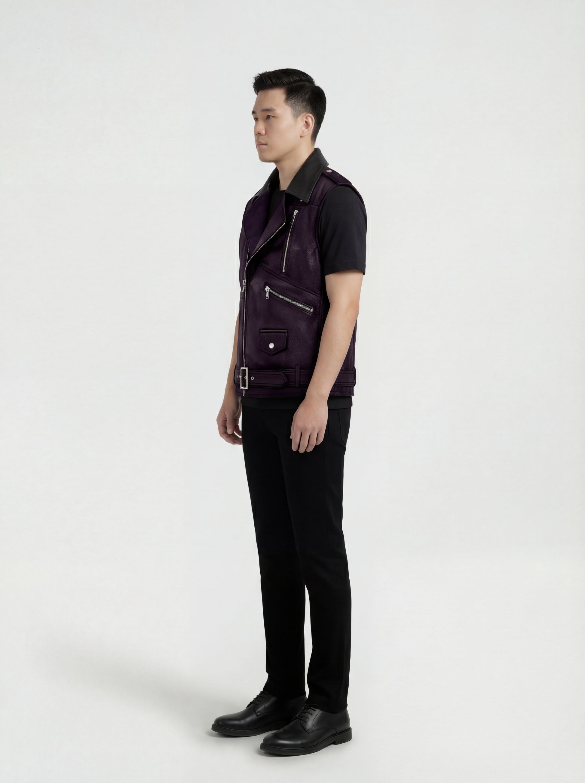 Side profile of Maverick Rocco leather biker vest showing deep armhole cut and cropped biker silhouette. Maverick Jacket.