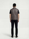 Rear view of male model wearing Maverick Vulcan leather biker vest showing broad shoulder fit and clean back styling. Maverick Jacket.