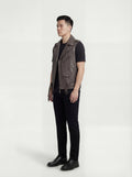 Side profile of Maverick Vulcan leather biker vest showing deep armhole cut and cropped biker silhouette. Maverick Jacket.