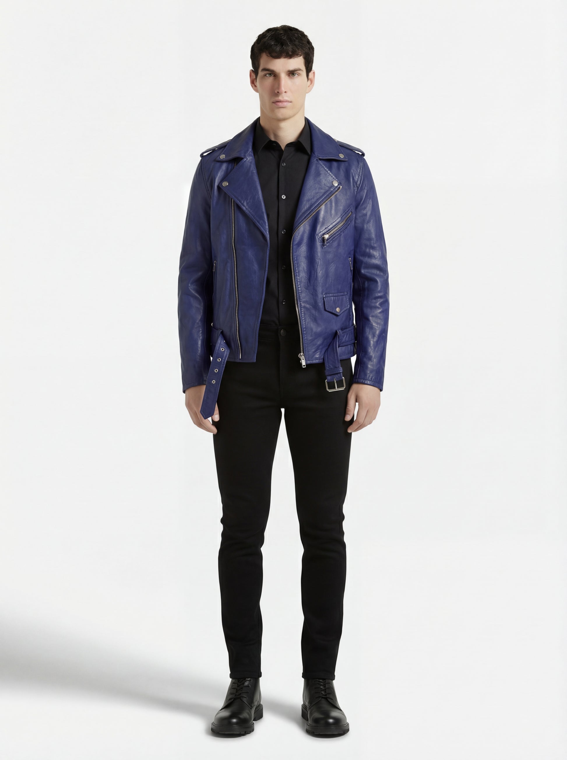 Male model wearing Maverick Vector blue leather jacket, slim fit, styled with black button-up shirt and black skinny jeans. Maverick Jacket.