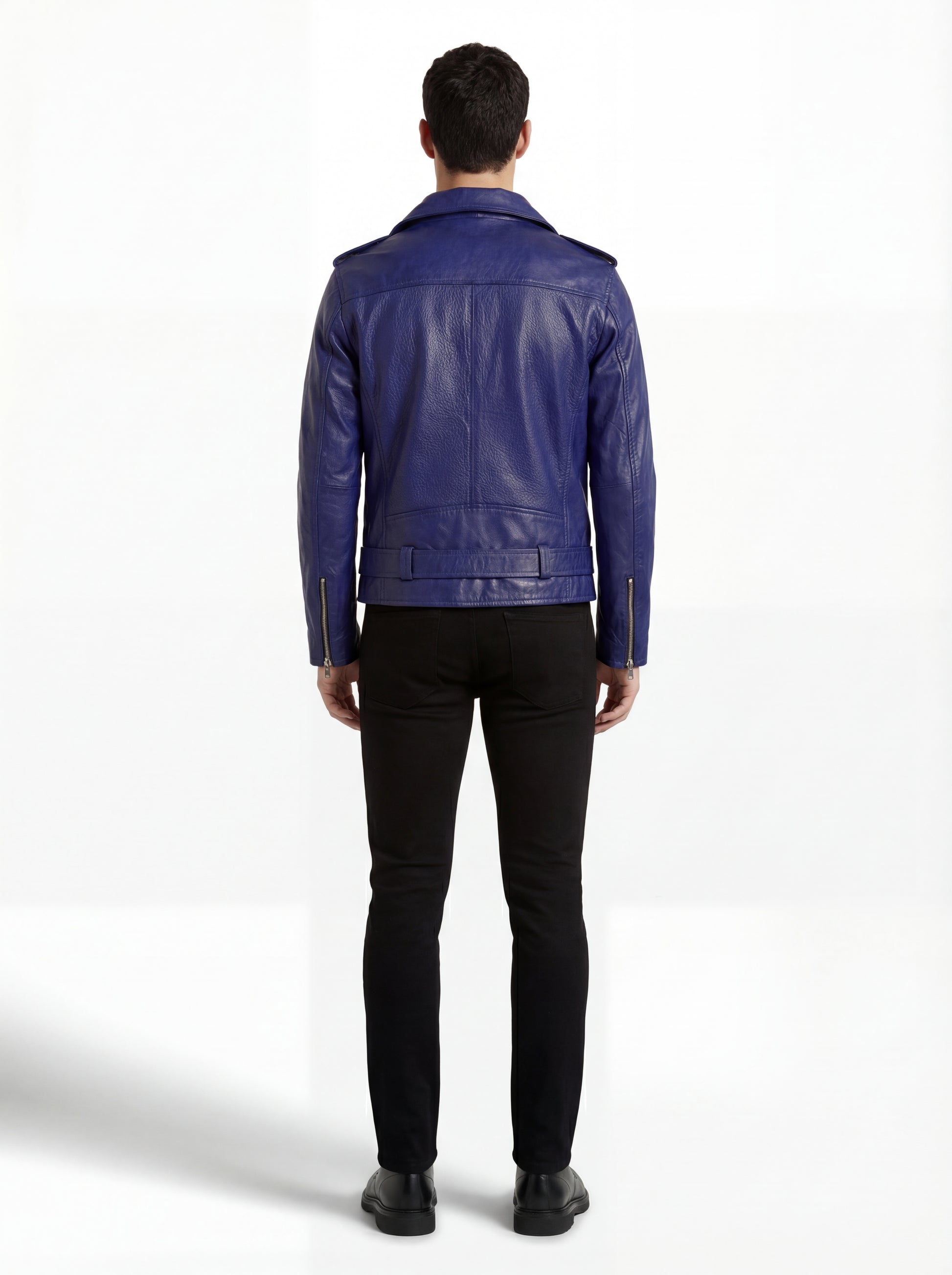 Rear view of male model wearing Maverick Vector blue leather jacket showing structured shoulder fit and belted hem styling. Maverick Jacket.